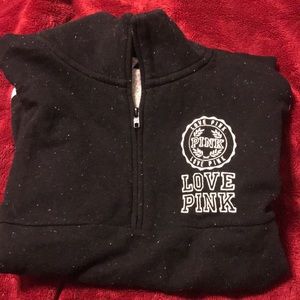 PINK quarter-zip sweatshirt.